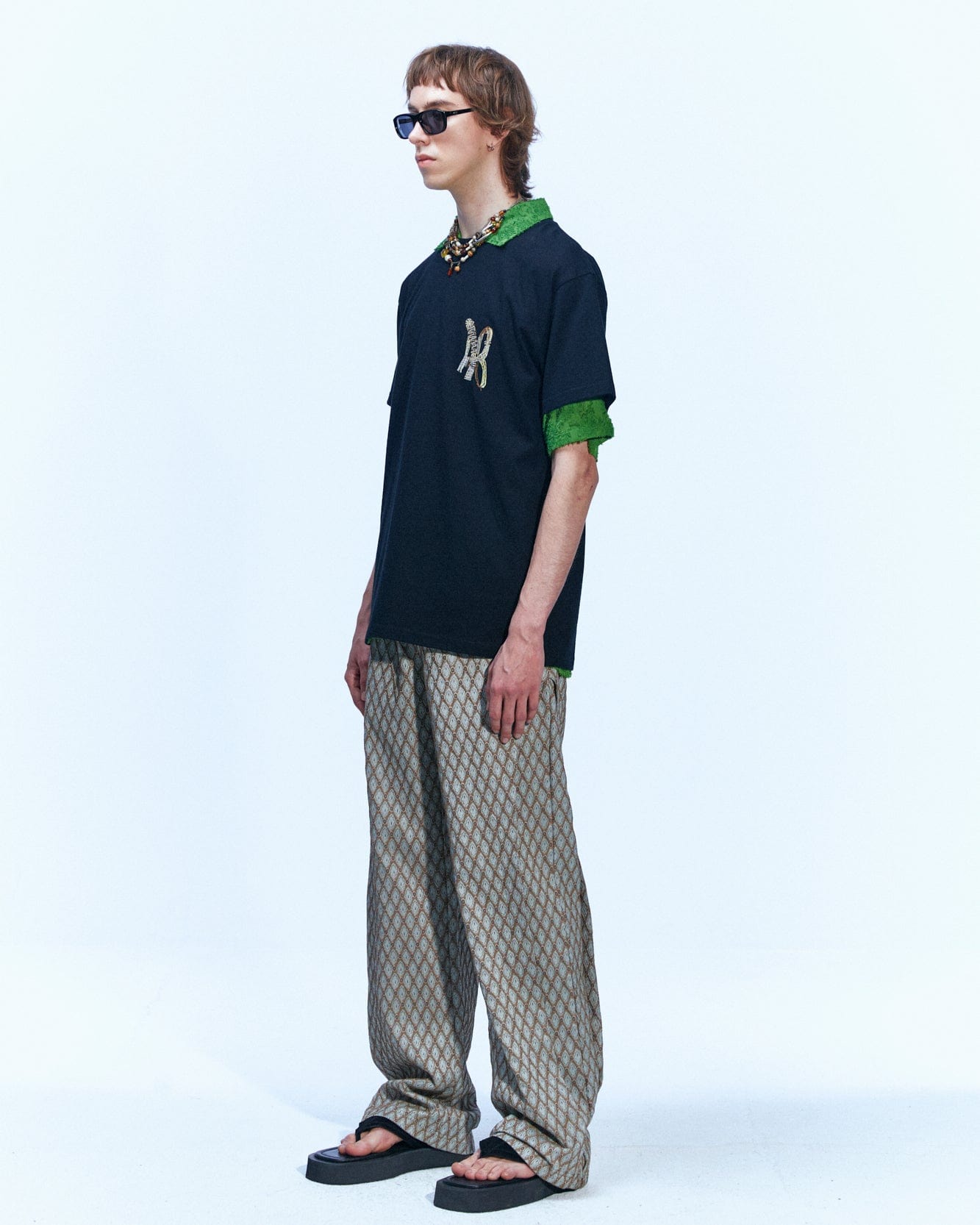 Andersson Bell MAKENI JACQUARD TRACK PANTS apa590m(BEIGE)